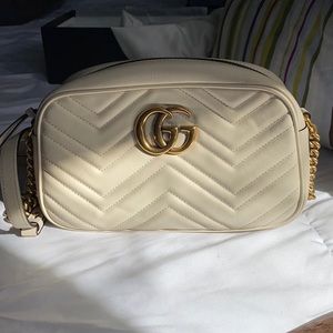 GG Marmont small shoulder bag. Cream in color.